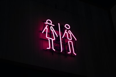 Dark area of the men and women the neon signs
